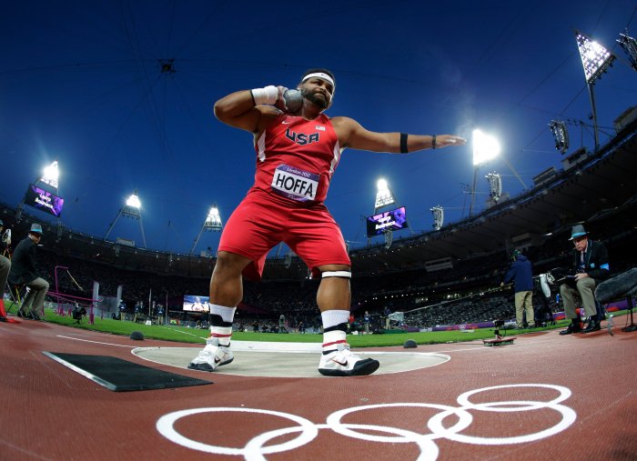 A shot putter throws the shot